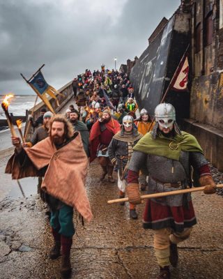 Sheringham Viking Festival and Parade 2024 ⚔️

Vikings once struck terror into the hearts of the inhabitants of our shores, but their return to north Norfolk will be very much welcomed. Plans have been drawn up to stage Sheringham’s Scira Viking Festival – which culminates in the burning of a model long ship.  This great event returns on Saturday 6th April 2024.

In 2023 thousands of locals and visitors lined the promenade and clifftops to watch, as a flame torch-carrying Viking honour guard hailed the arrival of the wooden boat, which, after being carried across the shingle, was set alight on the sand in a spectacular finale. More than a hundred re-enactors from four Norfolk groups made their way to the seafront, where waiting crowds were entertained by a fire-breathers from Norwich-based troupe Unhinged Circus and music specially arranged for the event by festival organiser, former TV and film set designer Chris Neville.

Spectators came from as far afield as Durham and Reading for the main festival day, which included battles on the beach and a living history village set up by Wuffa Saxon and Viking Re-enactment Society and featuring Viking cooking, crafts and weaponry, as well as have-a-go axe-throwing demonstrations and a working iron forge.

10am – 4pm Viking Village and Battles – Beeston Common, Cromer Road, Sheringham

7.00pm Viking Parade from Station Approach Car Park, Sheringham

7.15pm Boat Burning, promenade below The Esplanade, Sheringham seafront.

📸 North Norfolk News